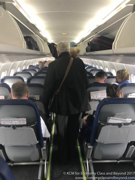 people on an airplane with people on the side
