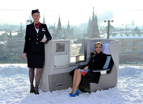 two women in a chair in the snow