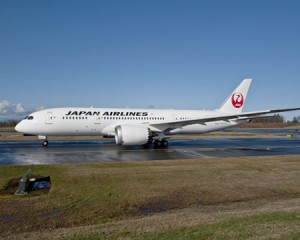 a white airplane on a runway