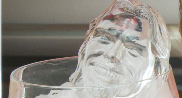 a glass sculpture of a man