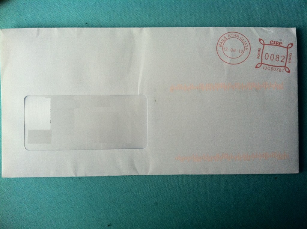 a white envelope with red stamps on it