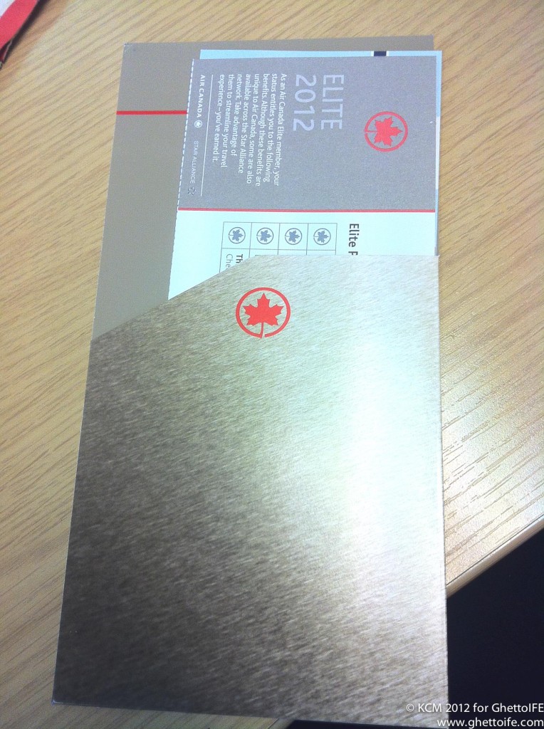 a silver envelope with a red logo