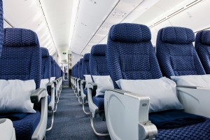 a row of blue seats in an airplane