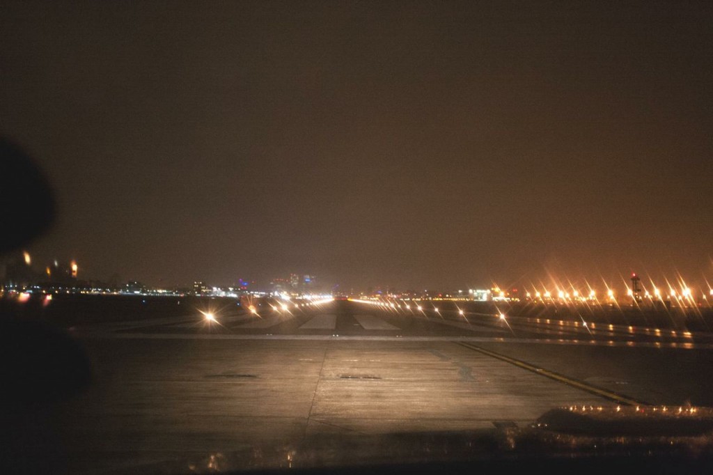 a runway at night with lights on