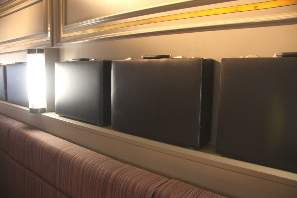 a row of briefcases on a shelf