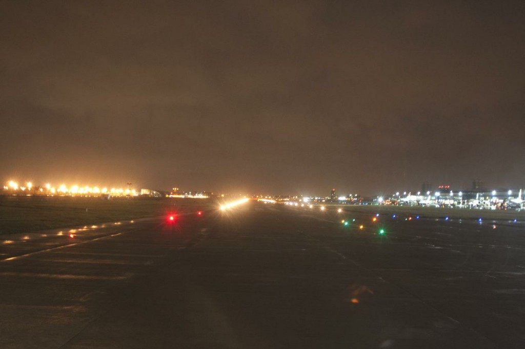 a runway with lights on it at night