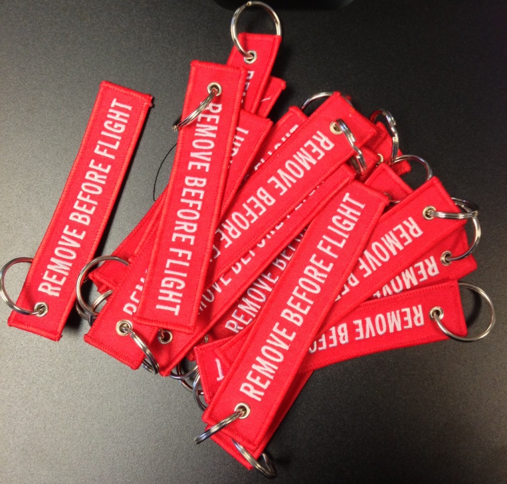 a group of red tags with white text