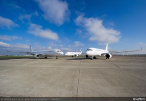 a group of airplanes on a runway