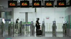 a woman with a luggage in a airport