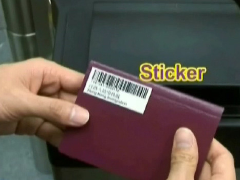 a person holding a sticker