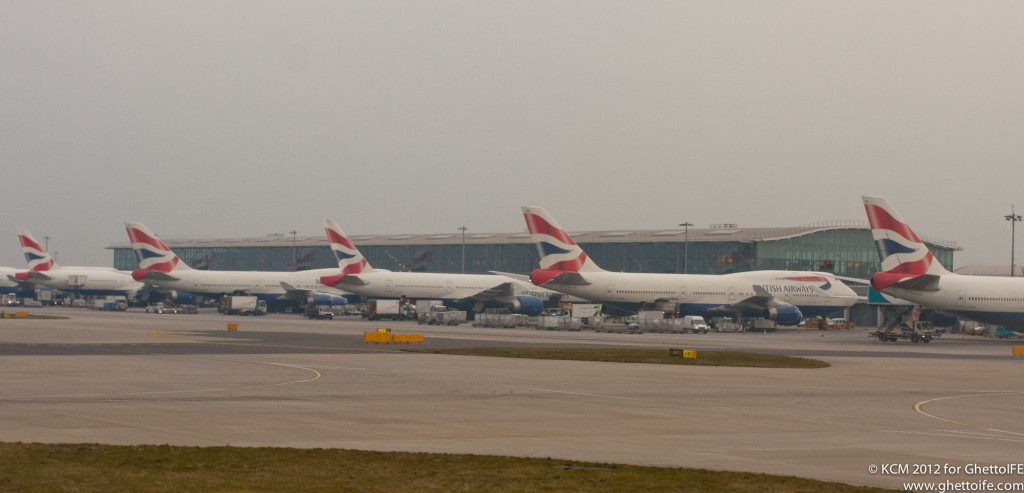 several airplanes parked at an airport