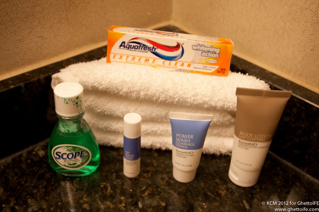 a group of personal care products on a towel