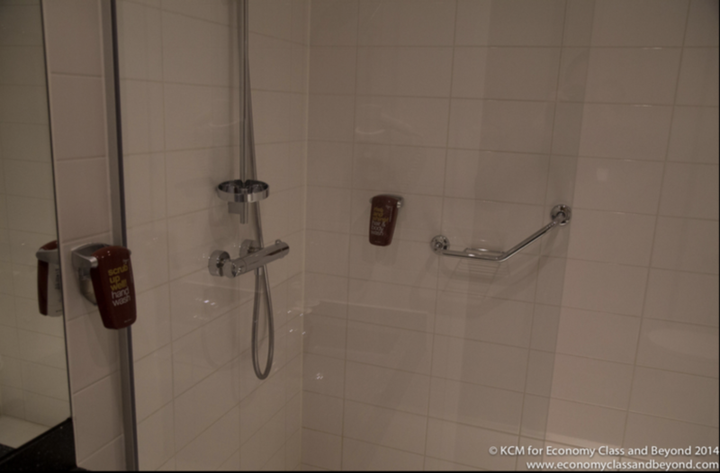 a shower with a hand held shower