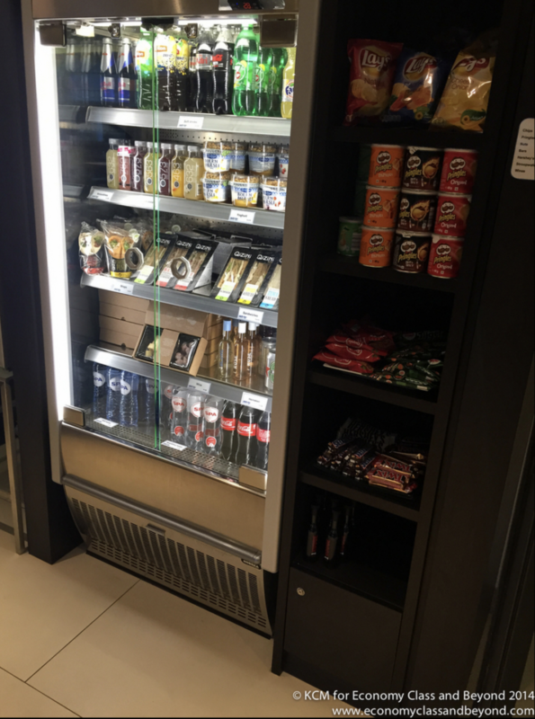 a display case of drinks and snacks