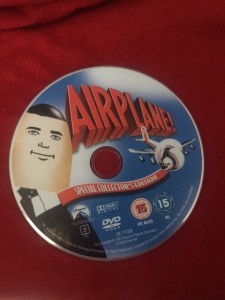 a blue and white disc with a cartoon face on it