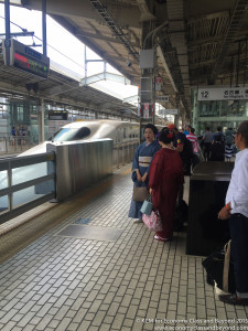 people standing in a train station