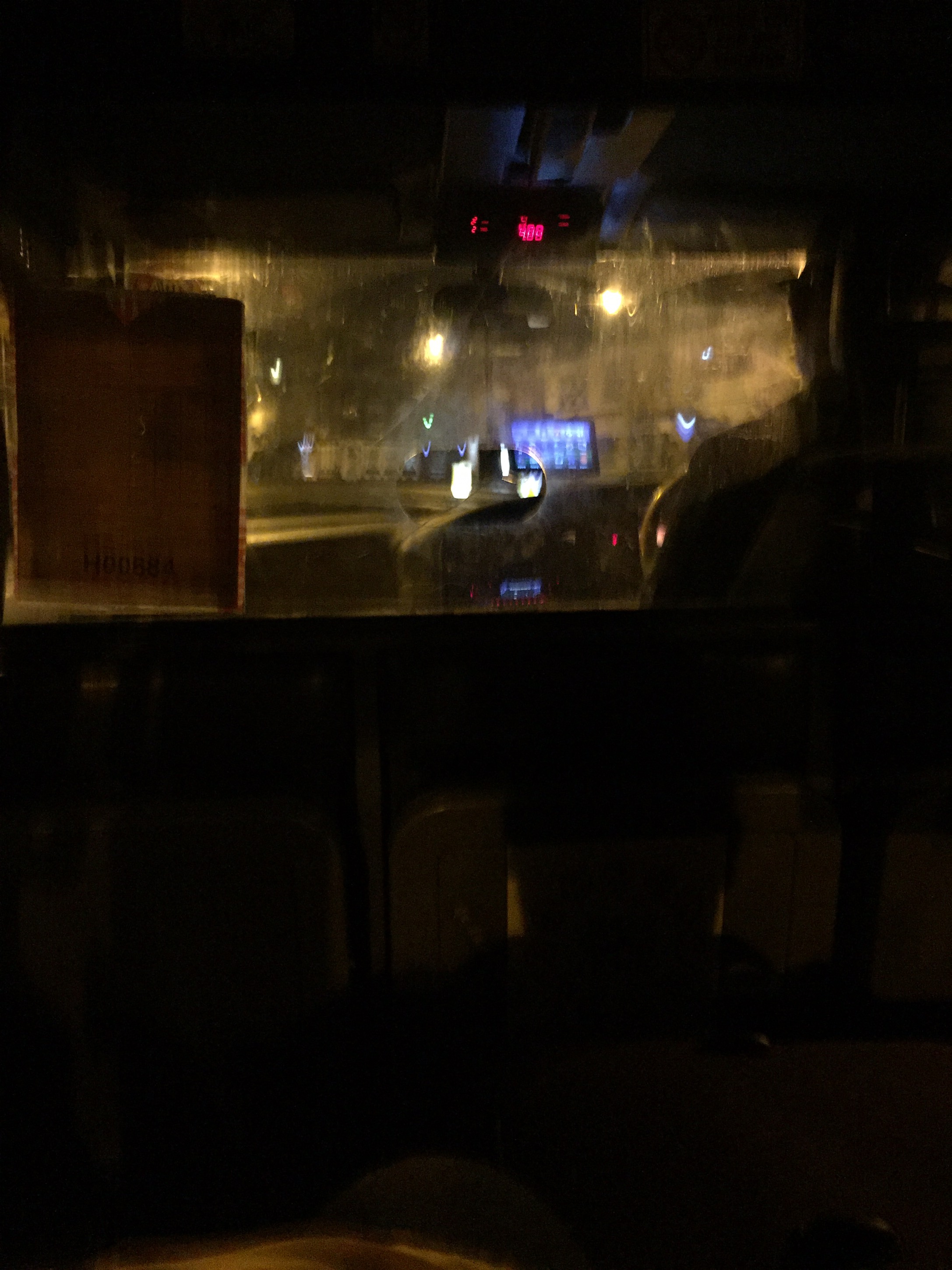 a view from inside a bus at night