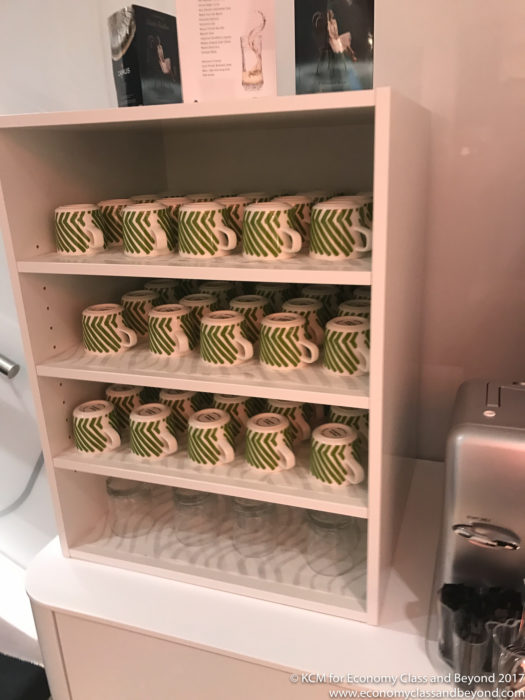 a shelf with mugs on it