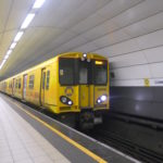 a yellow train in a tunnel