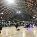 people inside of a train station with London Paddington station in the background