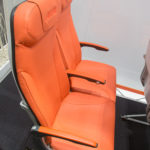 an orange seat in a plane