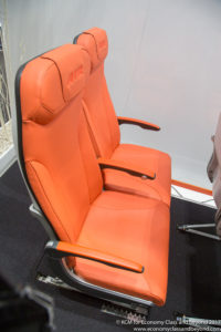 an orange seat in a plane