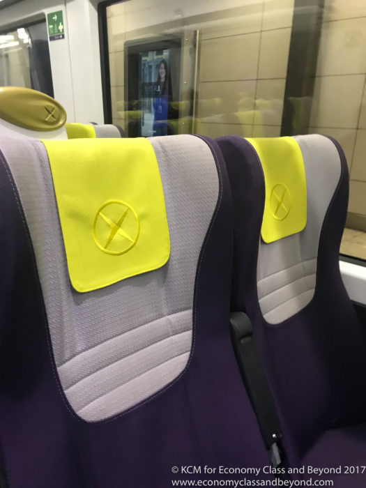 a seat with yellow and grey patches