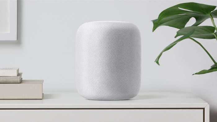 a white speaker on a table
