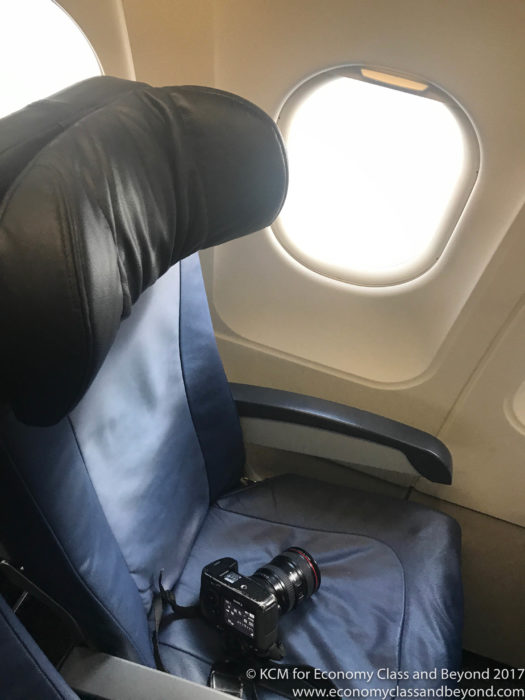 a camera on a seat in an airplane