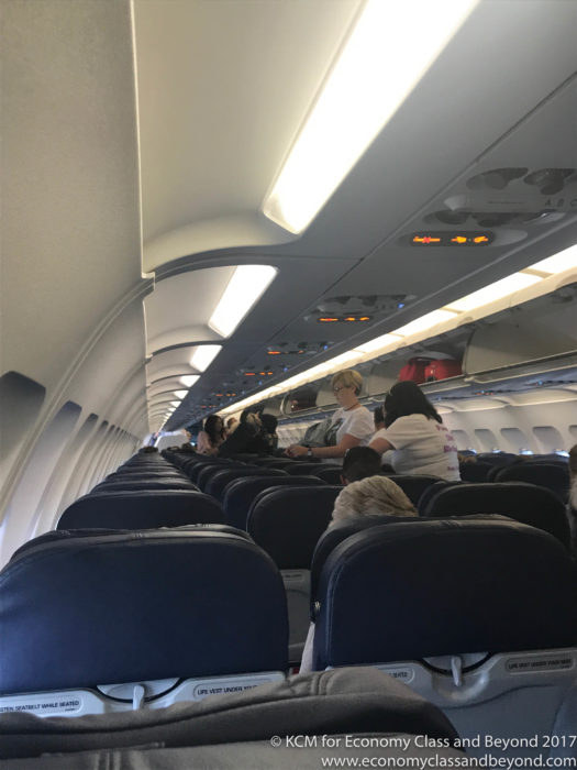 a group of people sitting on an airplane