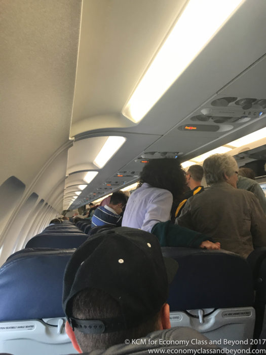 a group of people sitting on an airplane