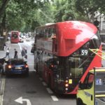 a double decker bus and cars on a street