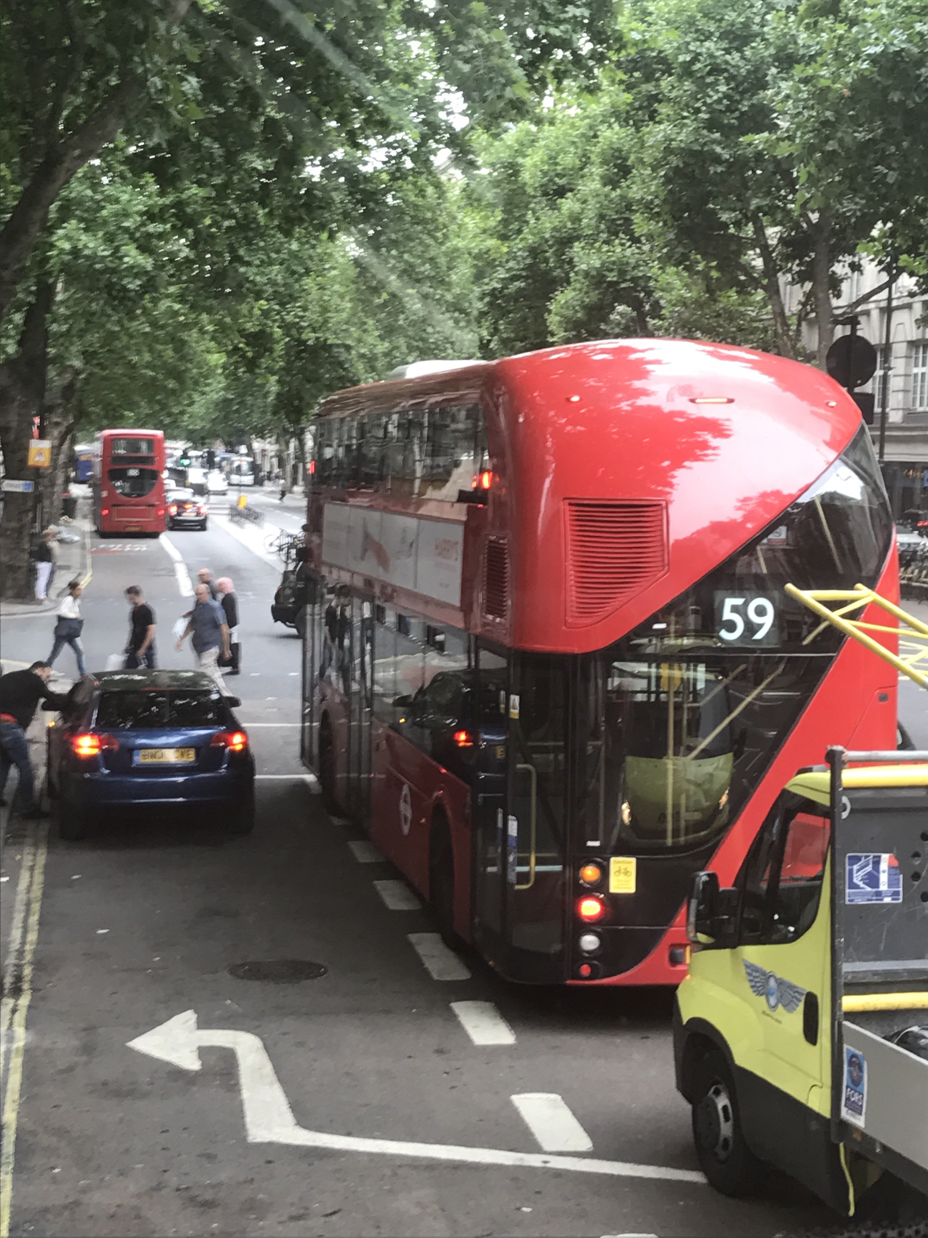 a double decker bus and cars on a street