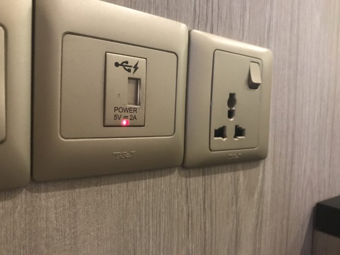 a wall outlet with a power plug and a power outlet