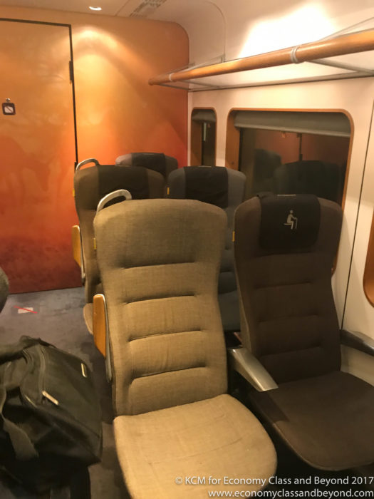 a group of chairs in a train