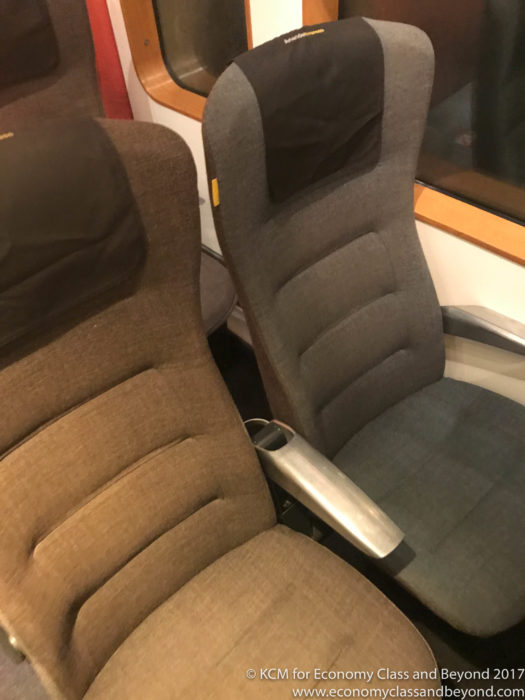 a pair of chairs in a train
