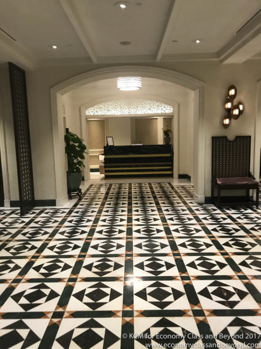 a black and white tiled floor in a hotel