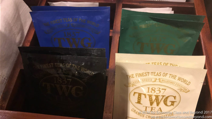 a group of tea bags in a wooden box