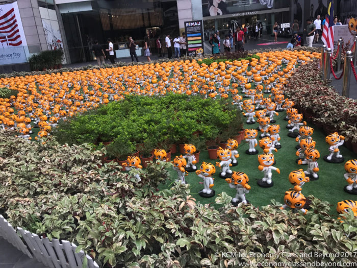 a group of small orange tiger statues
