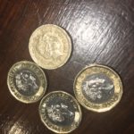 old and new pound coins - image, economy class and beyond