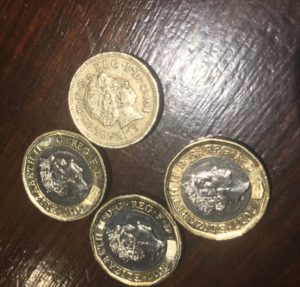 old and new pound coins - image, economy class and beyond