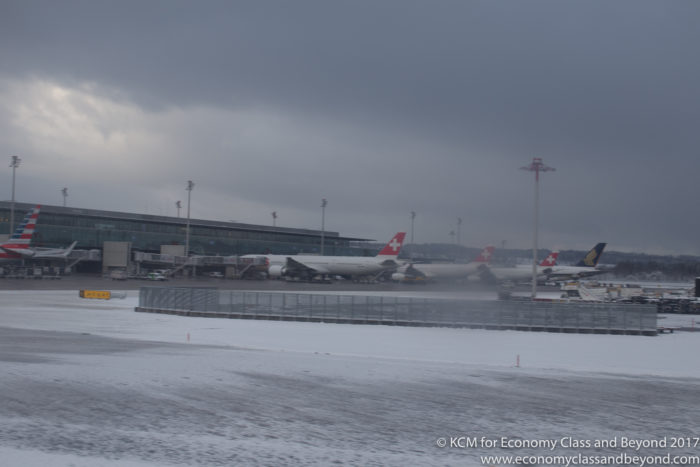airplanes on a runway in the snow