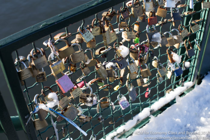 a group of locks on a fence
