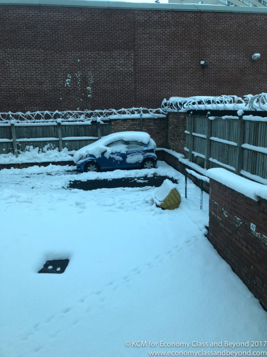 a car parked in a snow covered yard