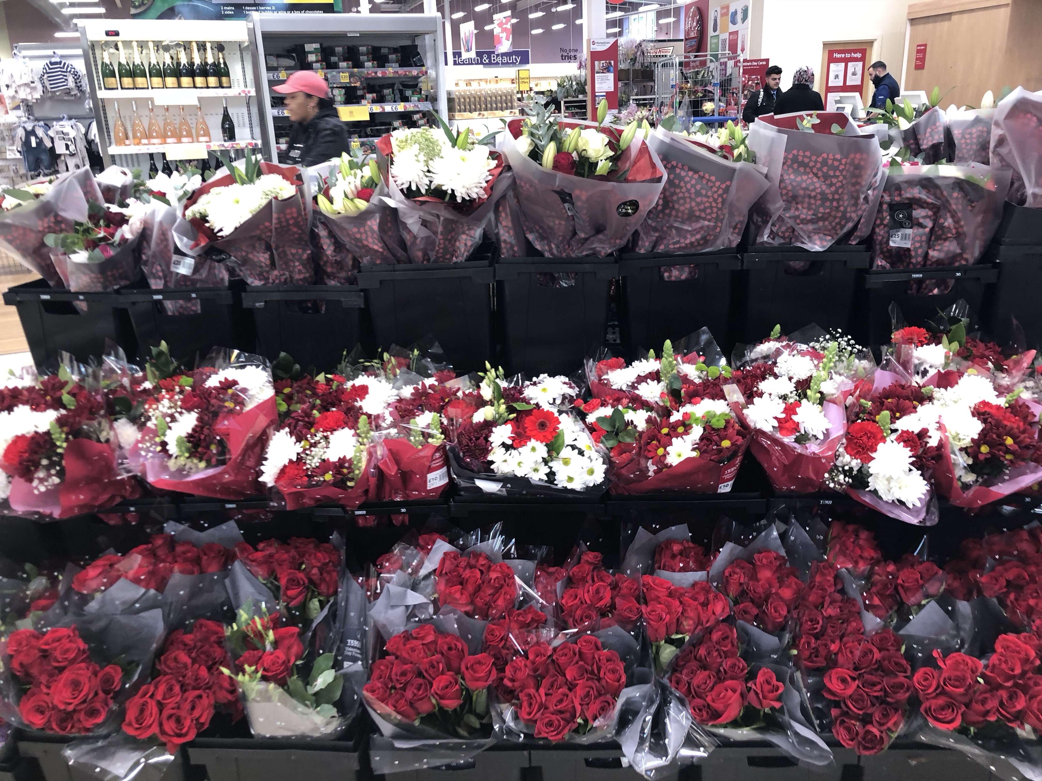 a bunch of flowers in a store