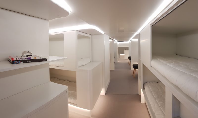 a room with bunk beds and a carpeted ceiling