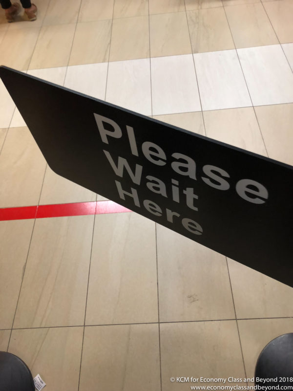 a black sign with white text on it