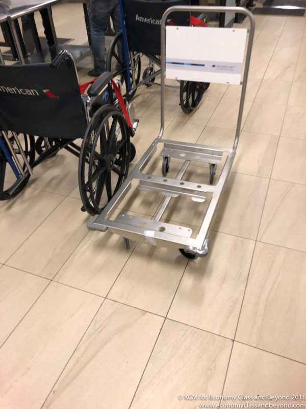 a cart with wheels and a sign