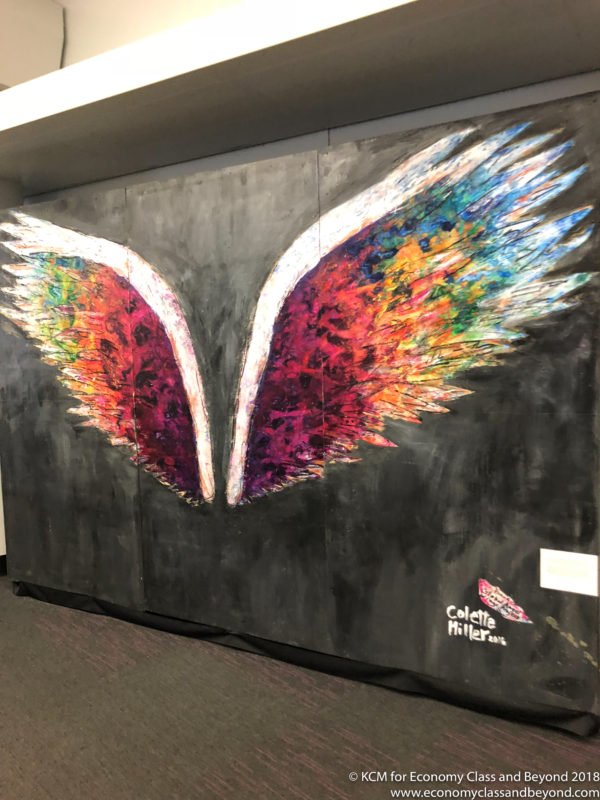 a painting of wings on a wall