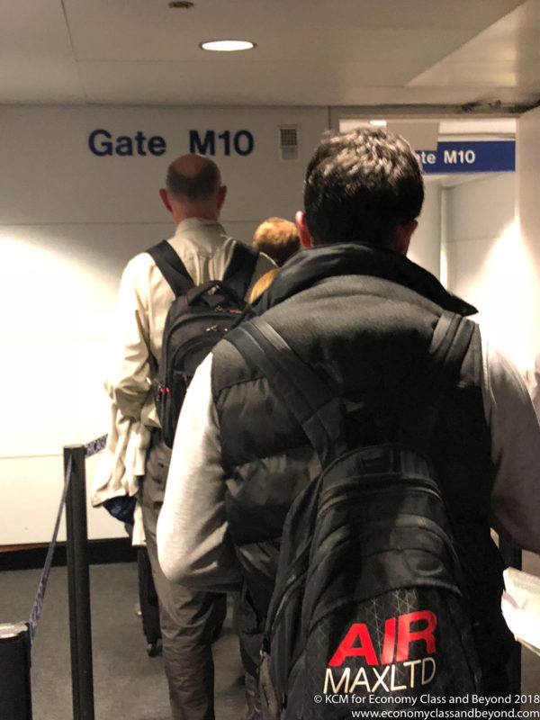 a group of people walking in an airport